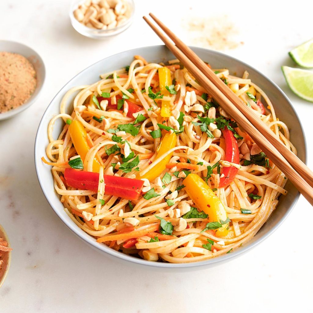 bowl of veggie pad thai with chopsticks
