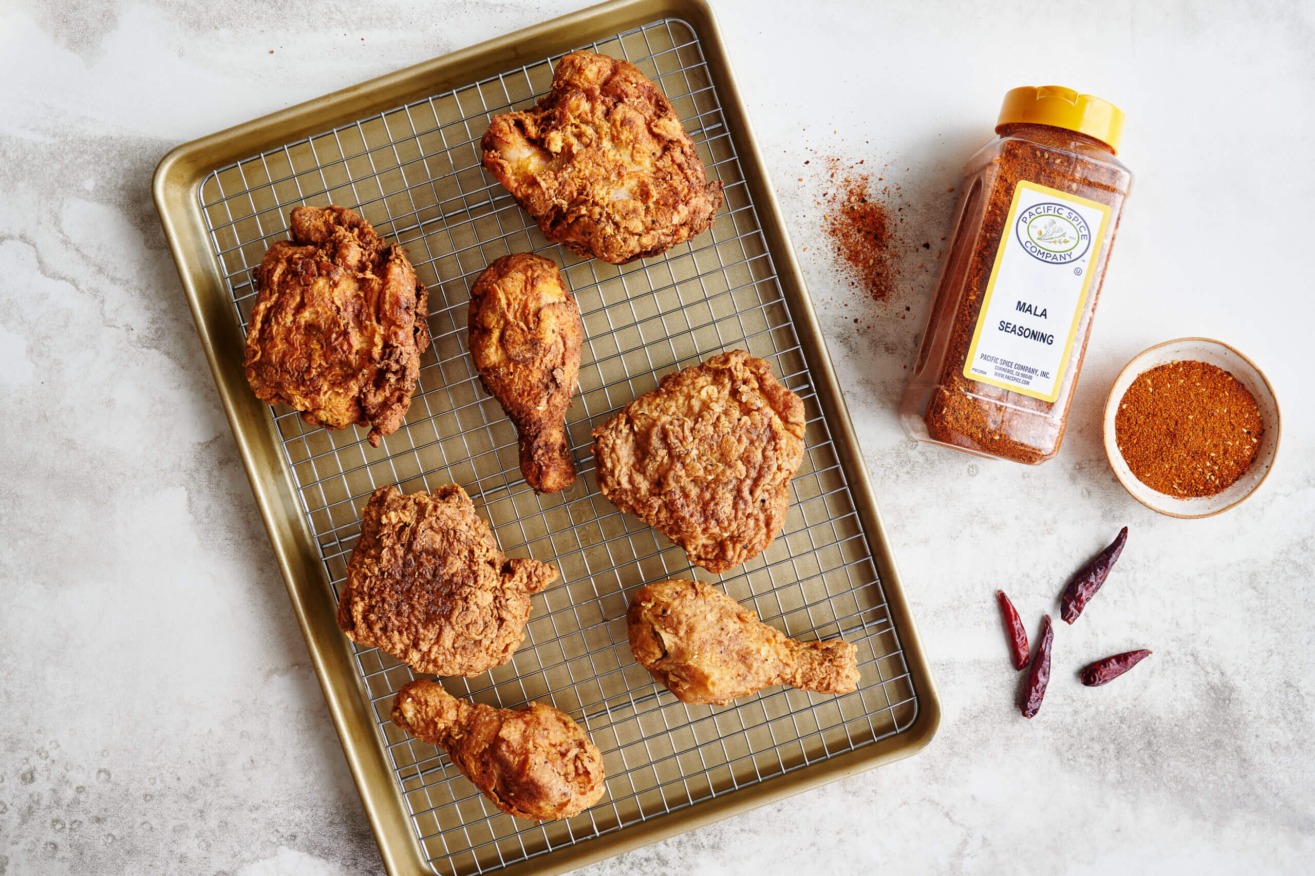 baking sheet of fried chicken with mala seasoning